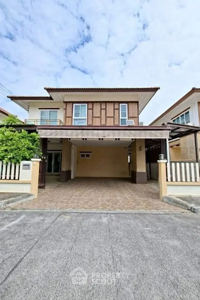 Charming two-story house with spacious driveway and modern design in a serene neighborhood.
