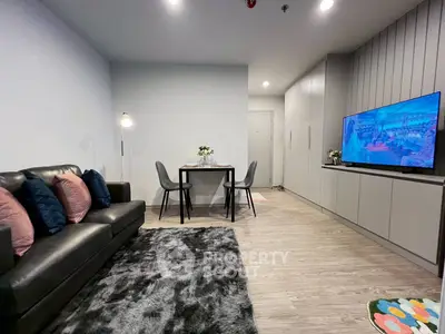 Modern living room with sleek furniture and cozy decor, perfect for relaxation and entertainment.