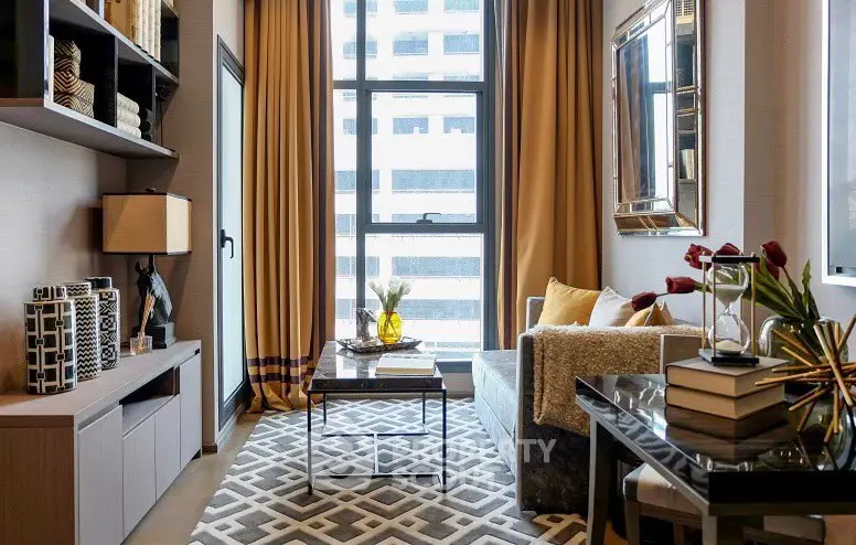 Modern living room with stylish decor and large window view in urban apartment.