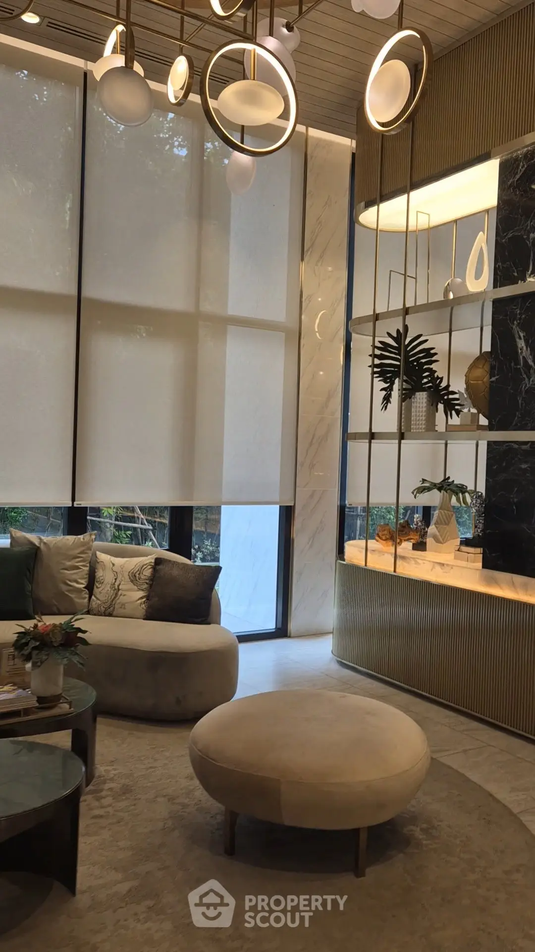 Luxurious modern living room with elegant decor and large windows