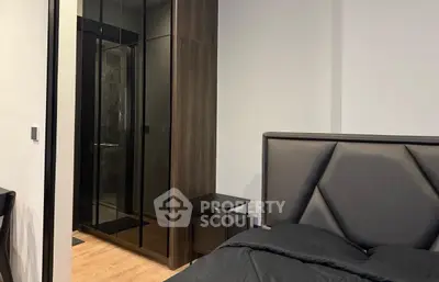 Modern bedroom with sleek design and mirrored wardrobe