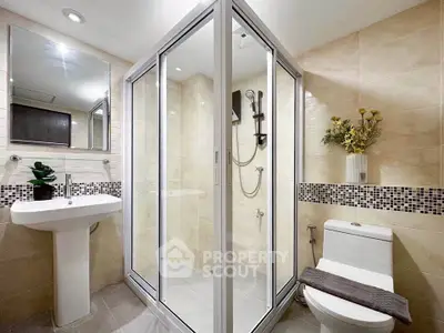 Modern bathroom with glass shower and elegant fixtures
