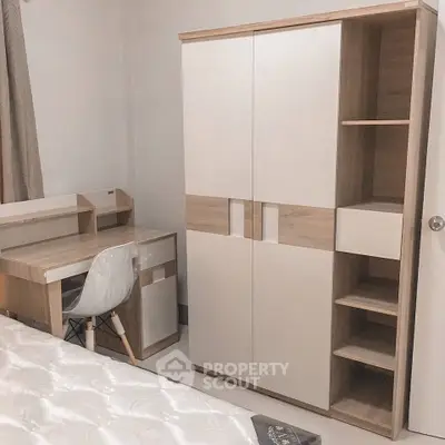 Modern bedroom with sleek wardrobe and compact study desk