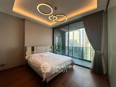Luxurious bedroom with modern lighting and city view balcony in high-rise apartment.