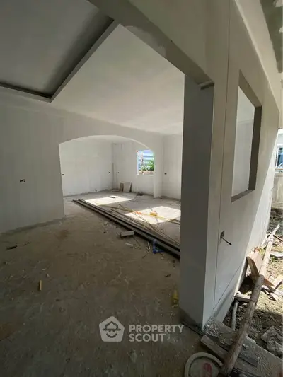 Spacious unfinished interior space with potential for customization and natural light.