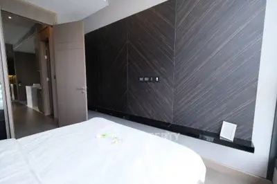 Modern bedroom with stylish wood paneling and minimalist decor