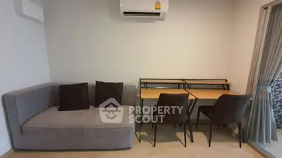 Modern living room with cozy sofa and stylish workspace setup