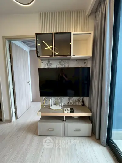 Modern living room with sleek TV unit and stylish decor
