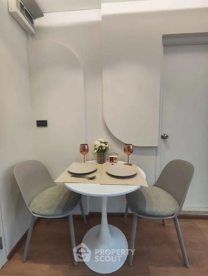 Cozy dining nook with modern table and chairs, perfect for intimate meals.