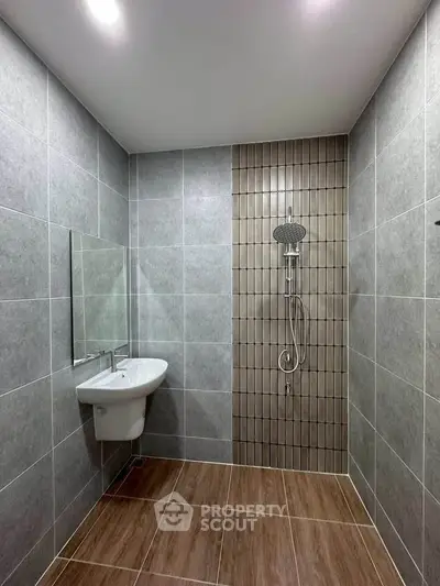 Modern bathroom with sleek tiles and contemporary shower design