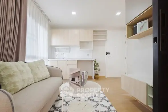 Modern living room with cozy sofa and open kitchen layout