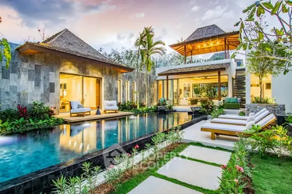 Luxurious tropical villa with private pool and lush garden, perfect for serene living.