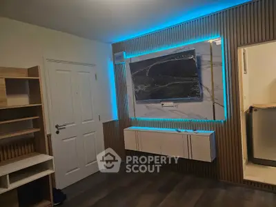 Modern living room with stylish wall paneling and LED lighting