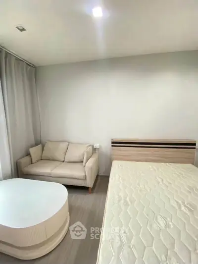 Cozy bedroom with modern furnishings and natural light