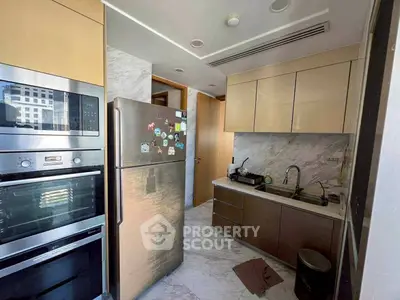 Modern kitchen with stainless steel appliances and sleek cabinetry
