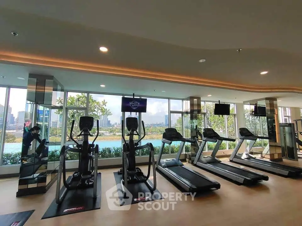 Modern gym with city view and state-of-the-art fitness equipment