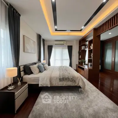 Luxurious bedroom with modern decor, ambient lighting, and elegant furnishings for a serene living experience.