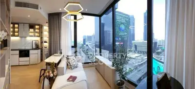 Luxurious modern living room with panoramic city view and stylish decor.