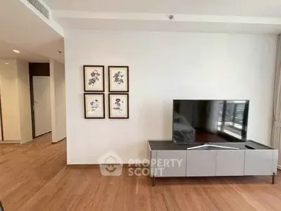 Modern living room with sleek TV stand and wooden flooring