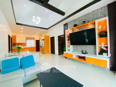 Spacious modern living room with stylish decor and open kitchen layout