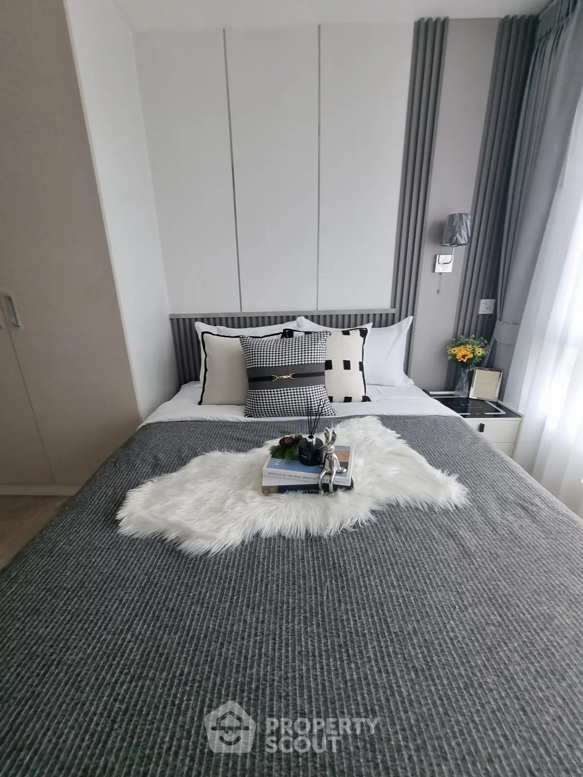 Cozy bedroom with stylish decor and natural light