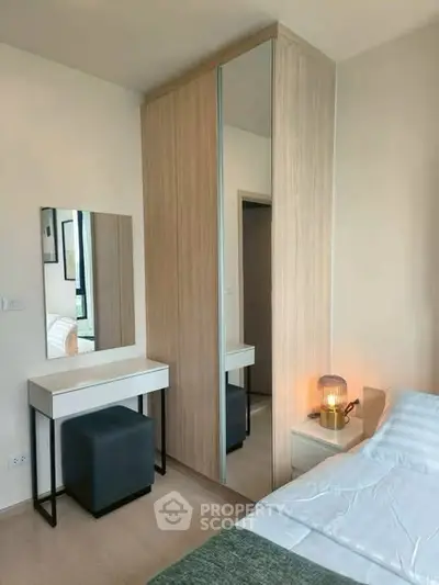 Modern bedroom with stylish wardrobe and cozy lighting, perfect for a serene living experience.