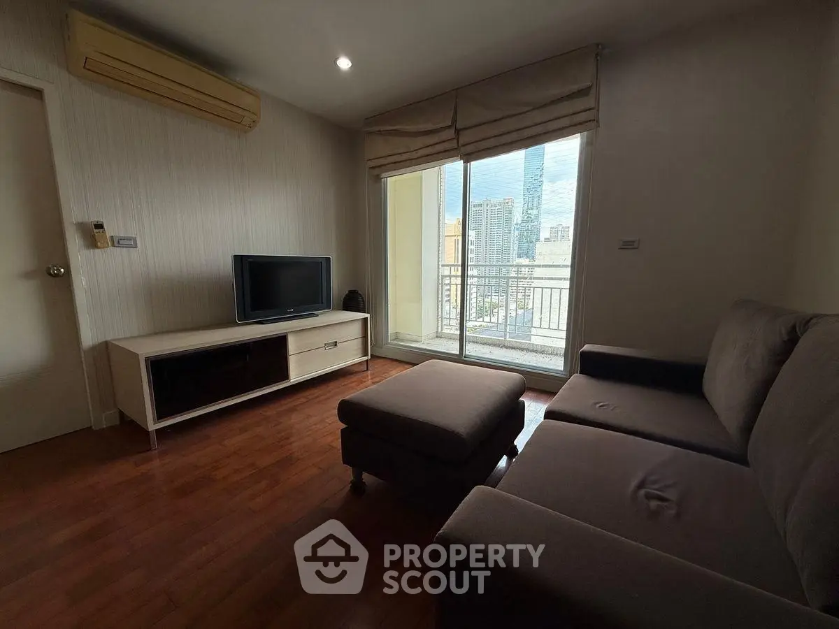 Cozy living room with modern furniture and city view balcony