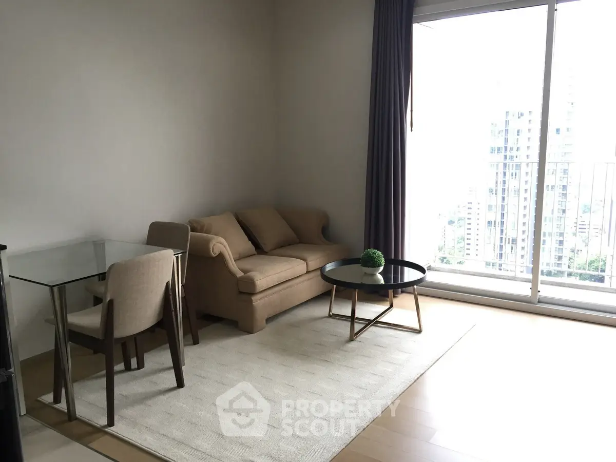 Modern living room with city view, featuring a cozy sofa and elegant dining area.
