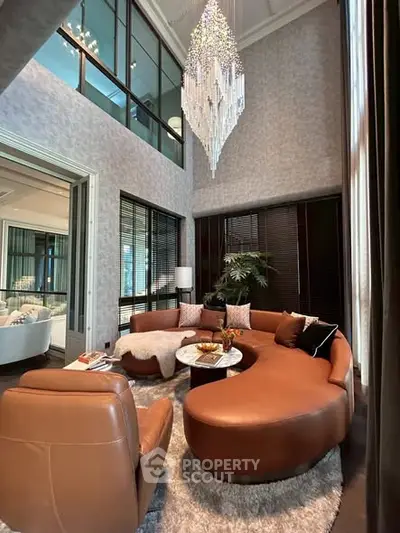 Luxurious living room with elegant chandelier and modern furniture