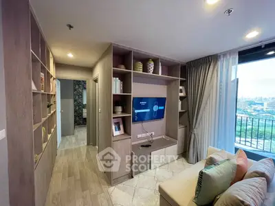 Modern living room with built-in shelves and city view balcony