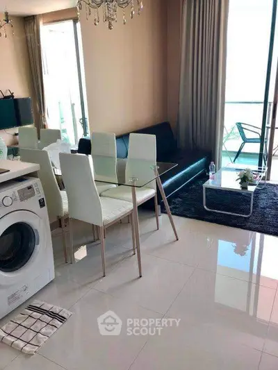 Modern living room with sleek furniture and washing machine, bright natural light