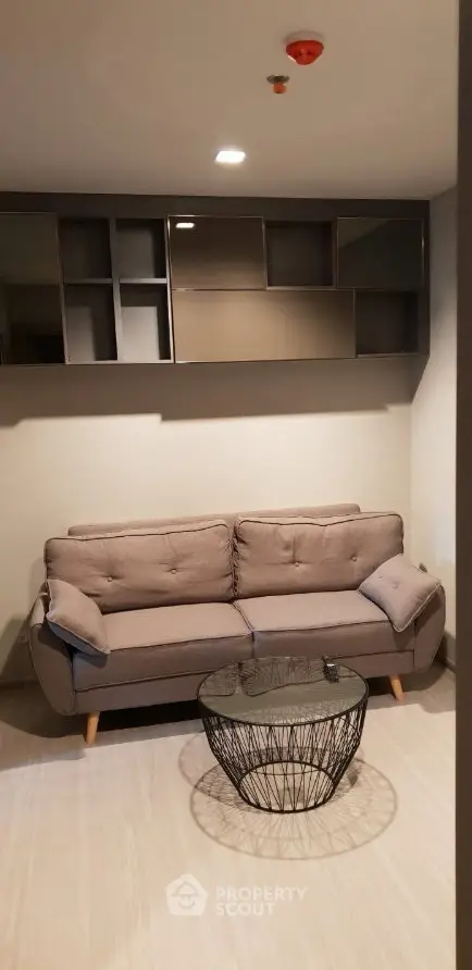 Modern living room with stylish sofa and unique coffee table, perfect for cozy relaxation.