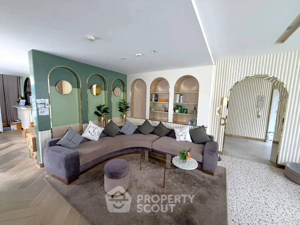 Luxurious living room with modern curved sofa and elegant decor