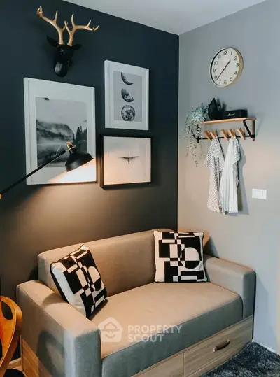 Stylish modern living room with cozy sofa and artistic wall decor