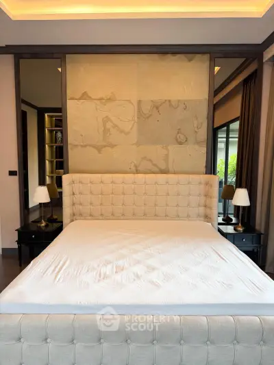 Luxurious bedroom with elegant tufted headboard and ambient lighting