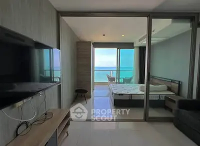 Modern beachfront apartment with stunning ocean view and stylish interior design.
