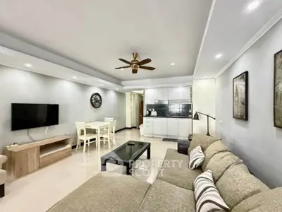 Spacious modern living room with open kitchen and stylish decor