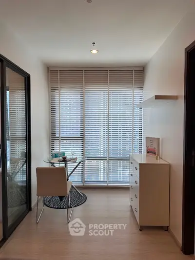 Bright study area with modern furniture and large windows in a stylish apartment