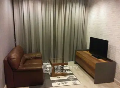 Cozy living room with leather sofa and modern TV stand