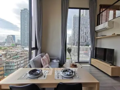 Modern living room with city view and balcony access in high-rise apartment