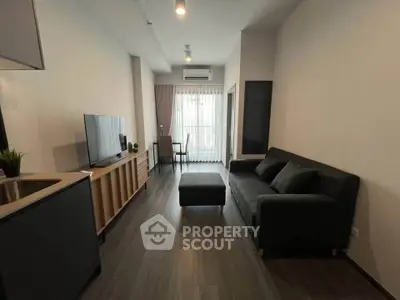 Modern living room with sleek furniture and natural light, perfect for urban living.