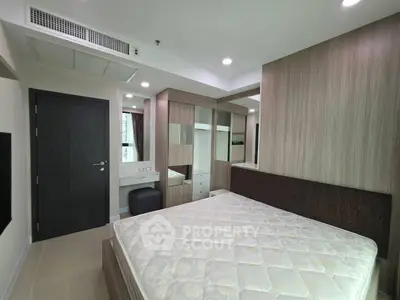 Modern bedroom with built-in wardrobe and cozy design