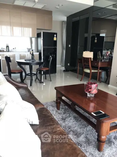 Modern living room with elegant furniture and open kitchen layout