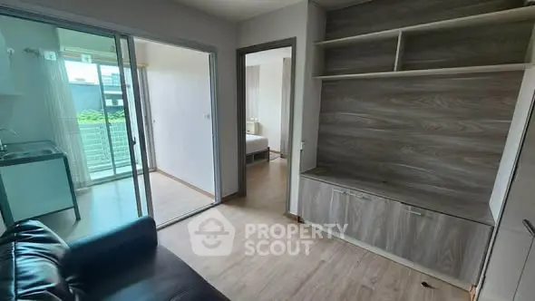 Modern apartment interior with open layout and balcony view