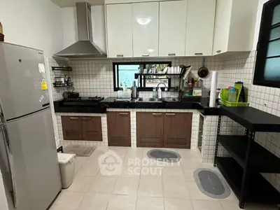 Modern kitchen with sleek cabinets and stainless steel appliances, perfect for culinary enthusiasts.