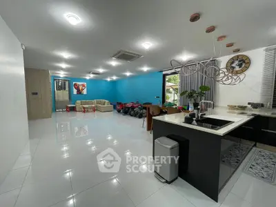 Spacious modern living room with open kitchen and stylish decor