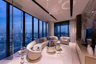 Luxurious high-rise living room with panoramic city views and elegant modern decor.
