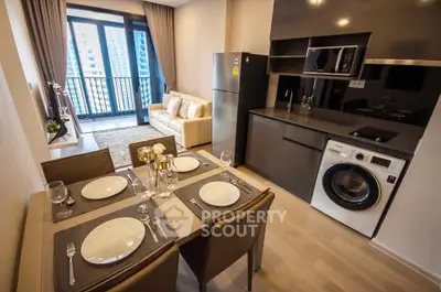 Modern apartment with open kitchen, dining area, and balcony view in urban setting.