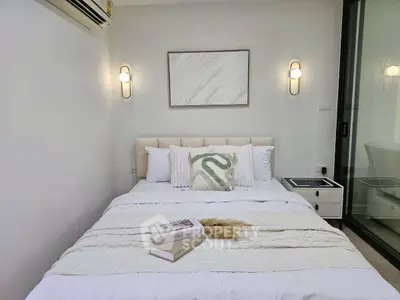 Cozy bedroom with modern decor and soft lighting, perfect for relaxation.