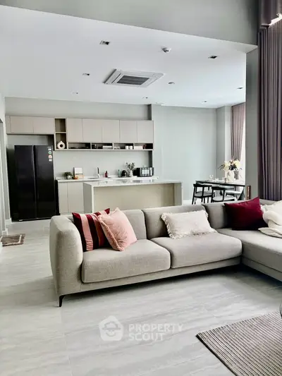 Spacious modern living room with open kitchen and stylish decor